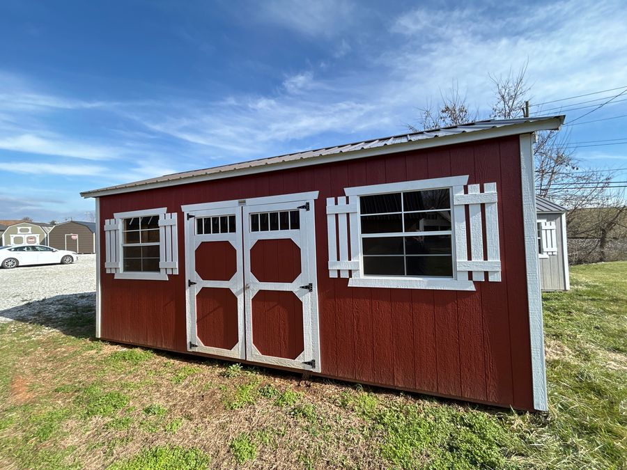 Gray lofted barn shed in a Tennessee field